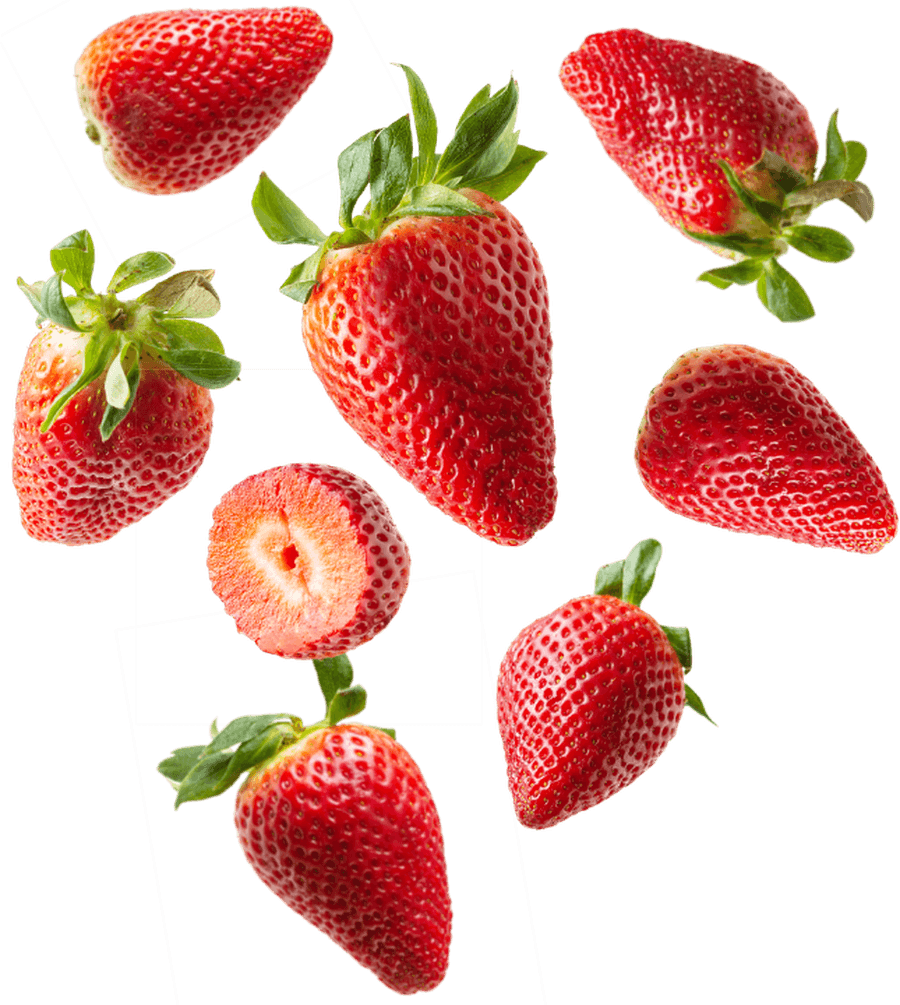 Ripe strawberries and a halved berry, scattered against a plain ground